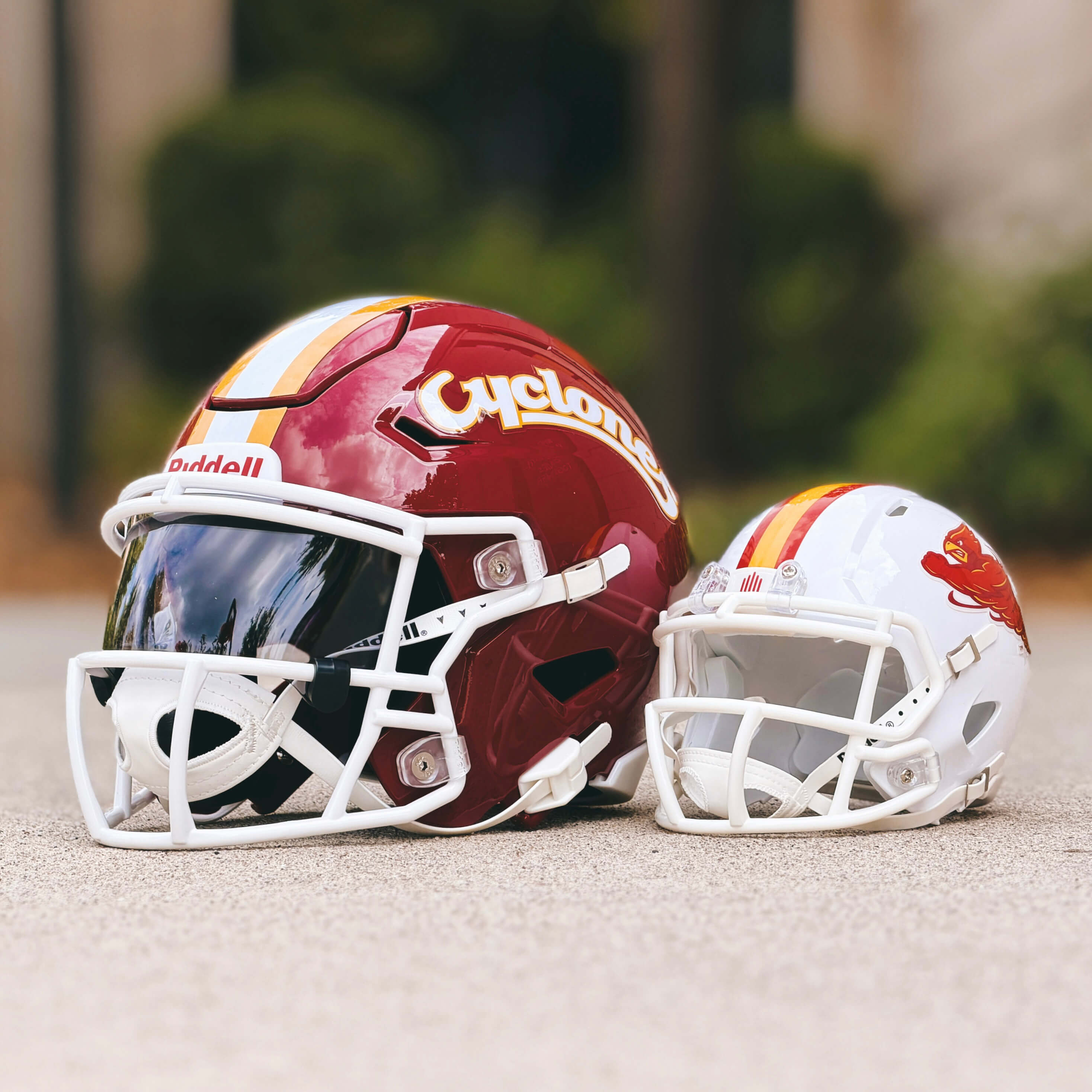 A photo showing Iowa State mini and midi helmets